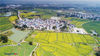 Aerial photos show the blooming rapeseed flowers in an area of 10,000 mu (666 hectares) in Yaxi Cittaslow Town, Gaochun District, Nanjing, March 17, 2019. The bright yellow color of the flowers, against the backdrop of black-white buildings, forms an amazing natural wonder, attracting many visitors to savor the flavors of spring.