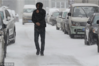 2019年3月21日，哈尔滨市气象台升级发布暴雪橙色预警信号，雪花伴随4-5级大风漫天飞舞，路上行人步履匆匆。