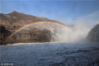 2019年3月17日，山西临汾，黄河上游全面开河，壶口瀑布飞起彩虹迎接游客。