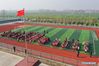 A flag-raising ceremony is held at Hai'anji Central Primary School in Xiangshui County, Yancheng, east China's Jiangsu Province, March 25, 2019. All 10 schools temporarily closed after a chemical plant blast in east China's Jiangsu Province have been repaired and reopened on Monday. Doors and windows in the 10 primary and middle schools were shattered by the powerful explosion on Thursday, with over 100 students suffering minor injuries caused by broken glass, the local education authorities said. Students were immediately taken to safety, and the injured were treated at nearby hospitals, said Gong Yansen, deputy head of the education bureau of Xiangshui County, where the plant is located. (Xinhua/Li Bo)