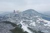 Aerial photo taken on Feb. 8, 2019 shows the snow scenery at Niushou Mountain cultural tourism zone in Nanjing, capital of east China's Jiangsu Province. (Xinhua/Ji Chunpeng)