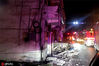 6月18日凌晨，四川雅安消防抵达震中，只见街道一片漆黑，满地石块，两旁的居民楼受损严重。