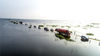2019年6月23日，江西九江，在永修县境内的永吴公路大湖池段再现“最美水上公路”，这一美景吸引不少游客前来感受水上公路这一独特景观，不少户外爱好者驾驶越野车体验在水上行驶的快感。