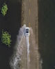 2019年6月23日，江西九江，在永修县境内的永吴公路大湖池段再现“最美水上公路”，这一美景吸引不少游客前来感受水上公路这一独特景观，不少户外爱好者驾驶越野车体验在水上行驶的快感。