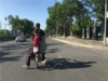 2019年6月8日，北京。高考进入第二天，清晨，一位父亲骑着电动车送女儿赶考。