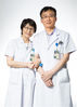 Liu Hongsheng (R), associate chief physician of thoracic surgery department, and his wife Ni Jun, chief physician of neurology department, pose for a photo at their work place of the Peking Union Medical College Hospital in Beijing, capital of China, Aug. 16, 2019.