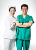 Yi Jie (R), chief physician of anesthesiology department, and his wife Lu Yue, supervisor nurse of ophthalmology department, pose for a photo at their work place of the Peking Union Medical College Hospital in Beijing, capital of China, Aug. 16, 2019. China has about 3.6 million qualified physicians and 4.1 million registered nurses.