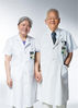 Qiu Guixing (R), academician of Chinese Academy of Engineering and chief physician of orthopedics department, and his wife Lin Shouqing, chief physician of gynaecology and obstetrics department, pose for a photo at their work place of the Peking Union Medical College Hospital in Beijing, capital of China, Aug. 12, 2019.