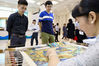 Visitors view Suzhou embroidery at an exhibition organized on the sideline of a news conference held by the State Council Information Office on Aug 23, 2019. [Photo by Zhu Xingxin/chinadaily.com.cn] 