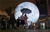 2016年9月15日，湖南省郴州市，中秋夜，12米超大“人造月球”景点吸引众多游客前来拍照留影，现场爆棚。