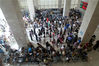 2014年6月30日上午9时20分，郑州市公安局出入境管理处办事大厅内挤满前来办理护照等业务的群众。白周峰/视觉中国