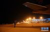 1月12日，起飞前，彭悦祚在长沙黄花国际机场检查飞机机身。新华社发（陈振海 摄）