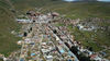 2020年11月28日报道，丁真的意外走红也带火了他的故乡理塘。理塘，藏语意为“平坦如铜镜般的草坝”，位于四川省甘孜藏族自治州中西部，是以藏族为主体的多民族聚居地，理塘高差悬殊，最低海拔2680米，最高海拔6204米，平均高度海拔4133米，县城海拔4014米，故有“世界高城”之称。2020年9月21日，四川甘孜，理塘县，千户藏寨景区。来源：IC photo 编辑/陈进