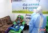 2月14日，武汉一名新冠肺炎康复患者在武汉大学人民医院献血屋捐献血浆。中新社记者 安源 摄