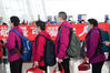Medical staffers from northwest China's Xinjiang Uygur Autonomous Region line up to board a plane at the Wuhan Tianhe International Airport, in Wuhan, central China's Hubei Province, March 17, 2020. Some medical assistance teams started leaving Hubei Province on Tuesday as the epidemic outbreak in the hard-hit province has been subdued. (Xinhua/Chen Yehua)