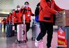 Medics supporting virus-hit Hubei Province arrive at the Zhengzhou East Railway Station in Zhengzhou, central China's Henan Province, March 17, 2020. Medical assistance teams started leaving Hubei Province early on Tuesday as the epidemic outbreak in the hard-hit province has been subdued. (Xinhua/Li An)