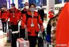 Medics supporting virus-hit Hubei Province arrive at the Zhengzhou East Railway Station in Zhengzhou, central China's Henan Province, March 17, 2020. Medical assistance teams started leaving Hubei Province early on Tuesday as the epidemic outbreak in the hard-hit province has been subdued. (Xinhua/Li An)
