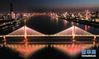 3月18日晚，武汉长江二桥上打出“守望相助”的字样（无人机照片）。新华社记者 陈晔华 摄