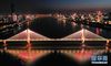 3月18日晚，武汉长江二桥上打出“携手奋战”的字样（无人机照片）。新华社记者 陈晔华 摄