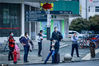 2020年3月25日，湖北省武汉市汉口火车站， 车站旁的公交车车场内，返汉的市民依次乘坐公交车，驶往目的地。图为武汉汉口火车站旁， 等候公交车的乘客。佚名/IC photo