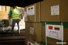 Workers unload health supplies from China at the Simon Bolivar International Airport, in La Guaira, Venezuela, on March 30, 2020. China has sent a team of medical experts to Venezuela to help the country fight the COVID-19 pandemic, Foreign Ministry spokesperson Hua Chunying announced Monday. The team has arrived on Monday, she said. (Xinhua/Marcos Salgado)