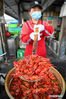 A staff member of a brasserie cooks crayfish at a food court in Jinhu County, east China's Jiangsu Province, May 12, 2020. Jinhu County, located in east China's Jiangsu Province and surrounded by Baima Lake, Baoying Lake and Gaoyou Lake, boasts favorable conditions to develop aquaculture. Crayfish is one of its popular aquatic products and its output value reached 400 million yuan (about 56.4 million U.S. dollars) with a production volume around 10,000 tons in 2019. Meanwhile over 80,000 local residents are engaged in crayfish-related industries. (Xinhua/Li Bo)