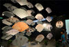 2014年7月15日，“旖旎从风——中国书·画·印折扇百家邀请展”在位于杭州的中国扇博物馆开幕，参观者在欣赏扇面艺术作品。施健学/IC photo