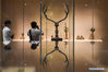 A journalist takes photos of the exhibits during a special exhibition with a selection of cultural relics dating from the Spring and Autumn Period (770-476 B.C.) to the Qin and Han Dynasty (221 B.C.-220 A.D.) at the Nanjing Museum in Nanjing, east China's Jiangsu Province, May 17, 2020. The special exhibition will kick off on May 18. (Xinhua/Li Bo)