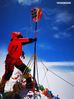 A Chinese surveyor conducts surveying atop Mount Qomolangma on May 27, 2020. (Xinhua/Tashi Tsering)

