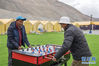 　登山队员在珠峰大本营玩桌上足球（5月1日摄）。新华社记者 孙非 摄