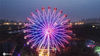  2020年7月20日，江苏淮安，市民在“萤火虫之夜”梦幻灯光节上游玩。