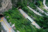 2020年7月28日，河南省焦作市修武县云台山景区，航拍中国著名奇迹公路叠彩洞，道路如巨龙盘旋在太行山悬崖峭壁上，23个隧洞各有名字。