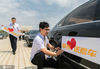 2020年7月4日，内蒙古呼和浩特市，爱心司机为车辆张贴“爱心送考”标识。