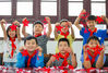 2020年7月30日，在江苏省如皋市迎新社区，小朋友在展示创作的红色剪纸作品。