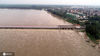  2020年8月14日，洪水经过沂河山东省临沂市郯城县马头镇段拦河闸（无人机照片）。