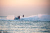 2020年7月30日，在山东烟台金沙滩海域，消夏的人们驾驶摩托艇，在辽阔的大海上，追风逐浪，自由驰骋。来源：张卫国/IC photo

