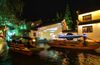 Photo taken on Sept. 27, 2020 shows tourist boats sailing on a canal amid decorative illuminations in the ancient town of Zhouzhuang in Kunshan, east China's Jiangsu Province. (Xinhua/Yang Lei)