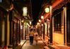 Tourists walk along an alleyway decorated with lanterns in the ancient town of Zhouzhuang in Kunshan, east China's Jiangsu Province, Sept. 27, 2020. (Xinhua/Yang Lei)