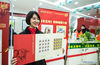 A staff member shows the newly issued special stamps themed on the Year of the Ox in Guiyang, southwest China's Guizhou Province, Jan. 5, 2021. China Post on Tuesday issued a set of two special stamps to mark the upcoming Year of the Ox. (Xinhua/Tao Liang)