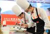 Chefs prepare dishes during a Sichuan cuisine skills competition in Chengdu, capital of southwest China's Sichuan Province, Oct. 18, 2021. The 2021 World Sichuan Cuisine Conference kicked off on Monday in Pidu District of Chengdu City, during which chefs show the trending culinary skills of Sichuan cuisines. (Xinhua/Jiang Hongjing)