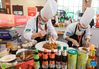 Chefs prepare dishes during a Sichuan cuisine skills competition in Chengdu, capital of southwest China's Sichuan Province, Oct. 18, 2021. The 2021 World Sichuan Cuisine Conference kicked off on Monday in Pidu District of Chengdu City, during which chefs show the trending culinary skills of Sichuan cuisines. (Xinhua/Jiang Hongjing)