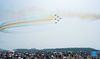 Visitors view performance by China's Bayi Aerobatic Team during the 13th China International Aviation and Aerospace Exhibition, or Airshow China 2021, in Zhuhai, south China's Guangdong Province, Oct. 1, 2021. (Xinhua/Liu Dawei)