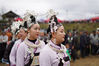 2021年10月21日，贵州黔东南，丹寨县扬武镇排莫村，身着节日盛装的苗族村民在跳月坪上跳传统芦笙舞。