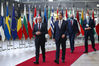 Austria's Chancellor Alexander Schallenberg, left, arrives for an EU summit in Brussels, Friday, Oct. 22, 2021. European Union leaders conclude a two-day summit on Friday in which they discuss issues such as climate change, the energy crisis, COVID-19 developments and migration.