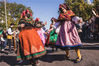 MADRID, SPAIN - OCTOBER 24: Women wearing traditional clothes dance during the Transhumance Festival on October 24, 2021 in Madrid, Spain. The Transhumance Festival is a traditional event with thousands of sheep filling the main roads of the Spanish capital. Since 1994, the event has claimed to highlight the role of transhumance, the seasonal moving of livestock between pastures, and extensive livestock farming as tools for conserving biodiversity and fighting climate change. (Photo by Aldara Zarraoa/Getty Images)