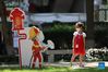 A kid plays at a park in Huli District of Xiamen, southeast China's Fujian Province, Oct. 5, 2021. Outdoor public places in Xiamen started to reopen from Oct. 5, as the results of the sixth round of citywide nucleic acid testing all came out negative. (Photo by Zeng Demeng/Xinhua)