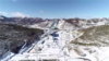 2021年11月22日，河北张家口，北京2022年冬奥会测试赛事如火如荼。（视频截图）航拍国家跳台滑雪中心。
