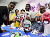 International students from Jiangsu University show off their opera masks on March 25. Under the guidance of amateur performers, the students painted the masks with different expressions and colors, which were in line with the characters' personalities. [Photo/IC]
A group of overseas students from Zimbabwe, Cote d'Ivoire, Kenya, and Cameroon, who are now studying at Jiangsu University in Zhenjiang, experienced traditional Chinese opera culture with local amateur performers on March 25 to celebrate the 2021 World Theater Day, which fell two days later. World Theatre Day is an international observance celebrated on March 27. It was initiated in 1961 by the International Theatre Institute.