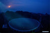 Photo taken on March 28, 2021 shows China's Five-hundred-meter Aperture Spherical radio Telescope (FAST) under maintenance in southwest China's Guizhou Province. FAST has identified over 300 pulsars so far. Located in a naturally deep and round karst depression in southwest China's Guizhou Province, it officially began operating on Jan. 11, 2020. (Xinhua/Ou Dongqu)