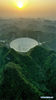 Aerial photo taken on March 29, 2021 shows China's Five-hundred-meter Aperture Spherical radio Telescope (FAST) at sunset in southwest China's Guizhou Province. FAST has identified over 300 pulsars so far. Located in a naturally deep and round karst depression in southwest China's Guizhou Province, it officially began operating on Jan. 11, 2020. (Xinhua/Ou Dongqu)